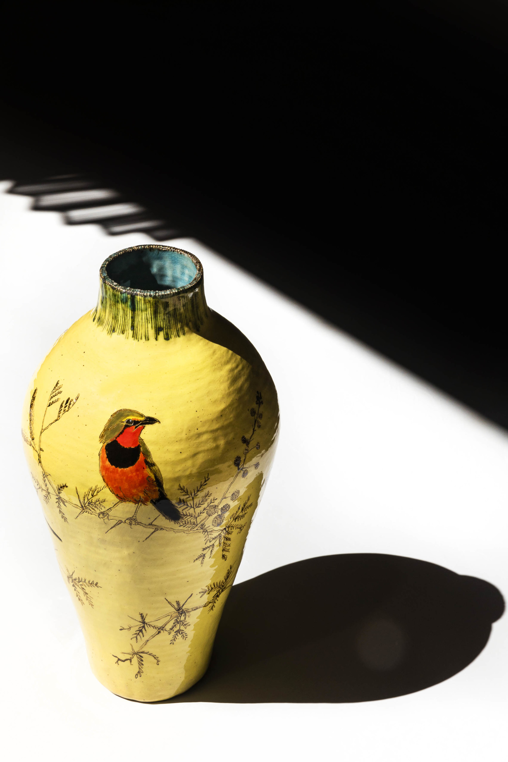 lisa ringwood yellow vase with shrikes on acacia thorn branches